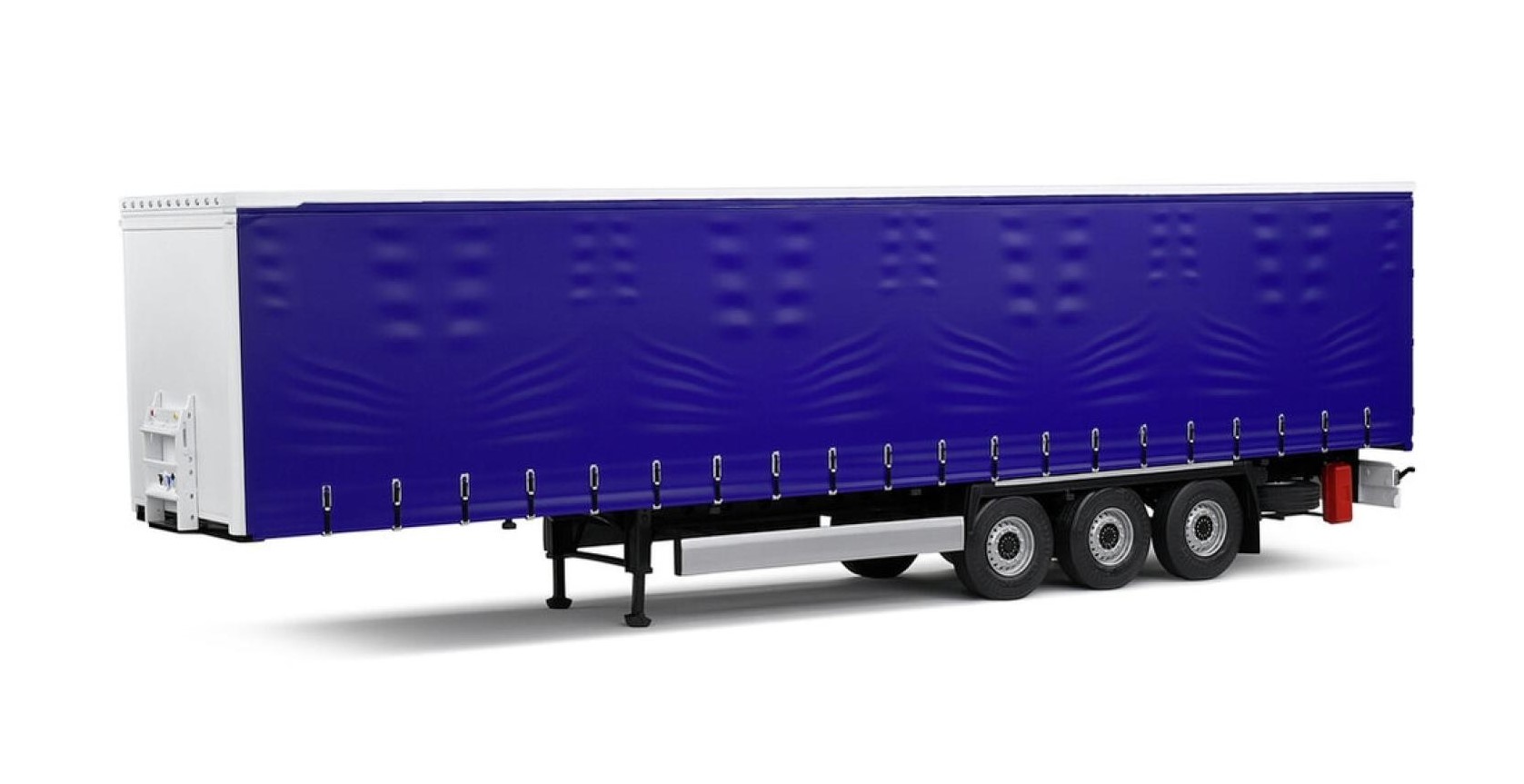 Mit seinem Planenaufbau bringt der Solido Tarpaulin Trailer im Maßstab 1:24 die ganze Faszination eines modernen Fernverkehrs-Aufliegers ins Sammlerregal. Die intensiv blaue Plane verleiht dem Modell eine klare, ruhige Linie, während die feinen Wellen und die angedeuteten Verschlüsse entlang der Unterkante realistische Stoffspannung und Funktionalität nachzeichnen.