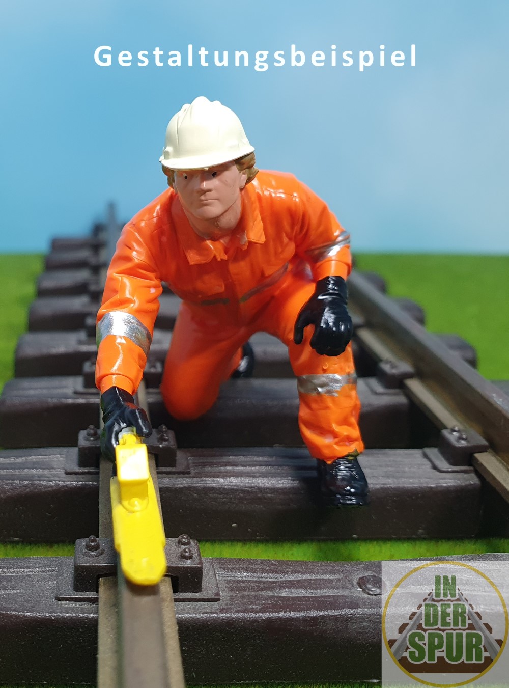 Piet legt vorsichtig einen Hemmschuh aufs Gleis um den Waggon beim Rangieren zu bremsen oder diesen zu fixieren. Eine tolle Figur - wie aus dem richtigen Eisenbahnalltag. 